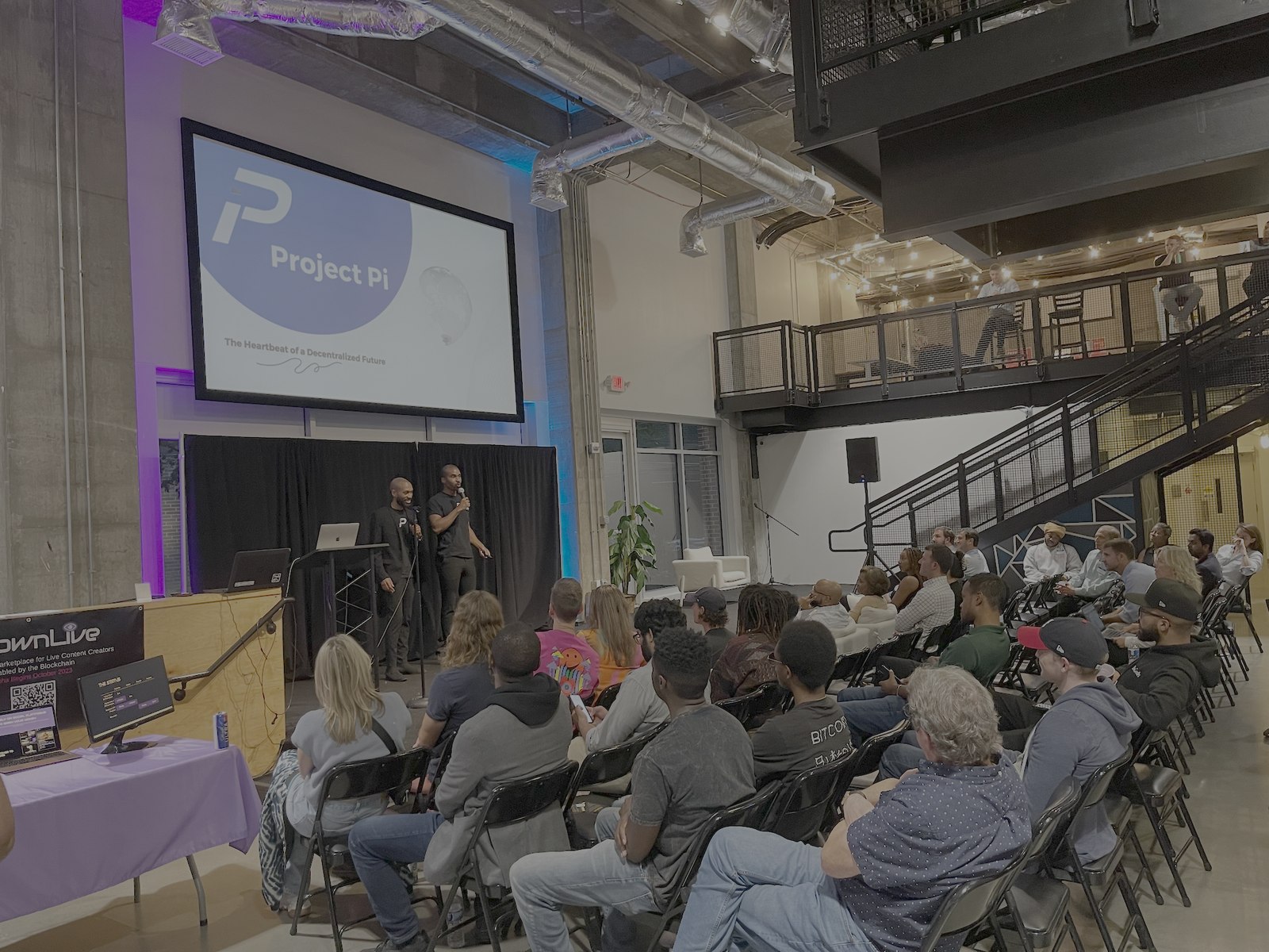Project Pi Labs founders pitching to a full room at the Atlanta Blockchain Center