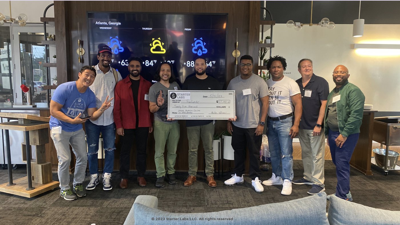 Drew Williams accepting the FanFundr PitchFest check